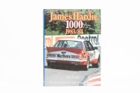 BATHURST 83/84: A hardcover James Hardie 1000 1983/84&nbsp;yearbook by Bill Tuckey, signed to inside cover page by Peter Brock and John Harvey, along with personal inscription and signature by author Bill Tuckey
