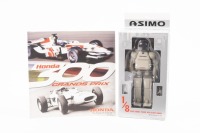 HONDA: Two interesting Honda items, including 'Honda 300 Grands Prix' commemorative 300 wins booklet with Honda Asimo 1/8 scale model figurine