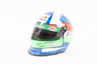 FRANCHITTI: A scale 1:2 replica of Dario Franchitti's 'Team Green' Formula One helmet, signed to the visor by Franchitti, a personal gift to Higgins from Franchitti