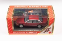 HOLDEN: A 1:43 scale model by Paradise Garage of the Holden VS Commodore Berlina in Masai Red Metallic, complete with original packaging