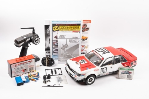 REMOTE CONTROL: A 1:10 scale electric remote control Brock/Richards #05 Holden VC Commodore, appears complete, with controller, battery for vehicle, and battery charger