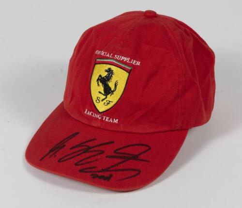 SCHUMACHER: An original 'Official Supplier "SF" Racing Team' red Tommy Hilfigher Ferrari cap signed by Michael Schumacher in 2001.