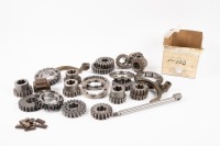 FT200: A group of Hewland FT200 gearbox parts, includes some possible unused cogs, selector forks, gears and other small gear set parts