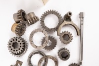FT200: A group of Hewland FT200 gearbox parts, includes some possible unused cogs, selector forks, gears and other small gear set parts - 3