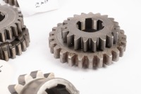 HEWLAND: A box labelled 'Hewland Mk5', contains gear parts of varying sizes - 13