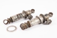 SHOCKERS: Two circa 1950s/60s Armstrong dial adjustable shockers, one stamped 'Type AT9 / A2624', as used on many British racing cars of the 1960s