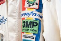 MOFFAT: An exceptional original circa mid 1970s race suit as worn by Allan Moffat, with associated sponsorship patches including Goodyear, BP, 3MP Bay City Radio and Dow Corning, suit by Hinchman Indianapolis - 6
