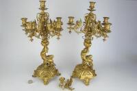 CANDELABRUM: A pair of cast gilt metal figural candelabrum