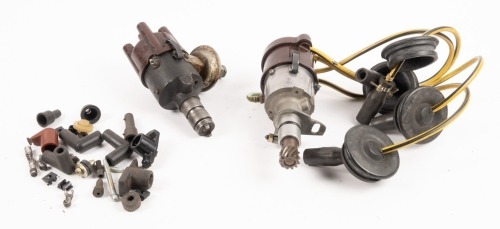 DISTRIBUTORS: Two Bosch four cylinder racing distributors with plug ends and loose fittings