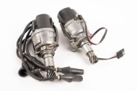 LUCAS: Two Lucas four cylinder distributors with caps, one with plugs