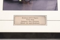 BT31: A photograph signed by Sir Jack & Ron Tauranac, features a rear view of the Brabham BT31 Repco 'bi-hi' wing, image 19.5cm high, 24.5cm wide - 2