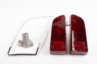 DE TOMASO: Four De Tomaso Mangusta parts, includes two Carello tail lights, a left side rear quarter glass frame and a a thermostat housing part [Location: Melbourne]