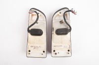 DE TOMASO: Four De Tomaso Mangusta parts, includes two Carello tail lights, a left side rear quarter glass frame and a a thermostat housing part [Location: Melbourne] - 2
