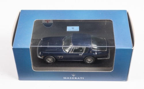 MASERATI: An IXO Models 1:43 scale Maserati Mistral coupe in dark blue, official Maserati product in original box [Location: Melbourne]
