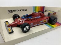 FERRARI 126K: A 1:24 scale model die-cast Burago 126K Turbo Formula One car, in original packaging [Location: Sydney] - 2