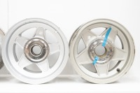 FERRARI WHEELS: Four Ferrari 365 alloy wheels with spinner plates and three hubs, includes two Cromodora 7.5" x 15" wheels (one has visible damage) and two non branded 8" x 15" wheels [Location: Melbourne] - 2