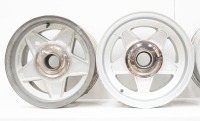 FERRARI WHEELS: Four Ferrari 365 alloy wheels with spinner plates and three hubs, includes two Cromodora 7.5" x 15" wheels (one has visible damage) and two non branded 8" x 15" wheels [Location: Melbourne] - 3