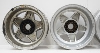 FERRARI WHEELS: Four Ferrari 365 alloy wheels with spinner plates and three hubs, includes two Cromodora 7.5" x 15" wheels (one has visible damage) and two non branded 8" x 15" wheels [Location: Melbourne] - 9