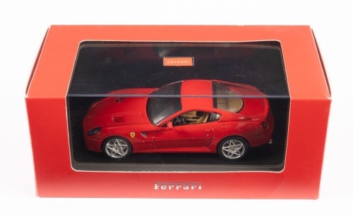 FERRARI 599 GTB FIORANO: An IXO Models 1:43 scale official Ferrari product 2006 Ferrari 599 GTB Fiorano in red paintwork in original box [Location: Melbourne]