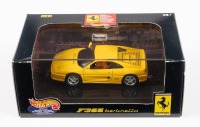 FERRARI F355: A Hot Wheels 1:43 scale model of the 1994 Ferrari F355 Berlinetta in yellow paintwork in original box [Location: Melbourne]