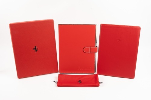 FERRARI DAY PLANNER: A leather bound Ferrari embossed Debden dayplanner organiser with supplemental 'Welcome to Ferrari' softcover book presented in red cardboard box with prancing horse emblem [Location: Melbourne]