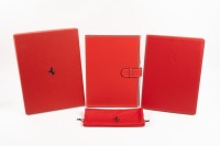FERRARI DAY PLANNER: A leather bound Ferrari embossed Debden dayplanner organiser with supplemental 'Welcome to Ferrari' softcover book presented in red cardboard box with prancing horse emblem [Location: Melbourne]