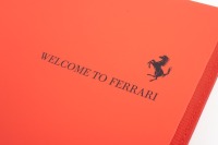 FERRARI DAY PLANNER: A leather bound Ferrari embossed Debden dayplanner organiser with supplemental 'Welcome to Ferrari' softcover book presented in red cardboard box with prancing horse emblem [Location: Melbourne] - 2