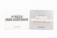 MITSUBISHI: A hardcover book within a slipcase titled 'Jan. 1st-22nd, 1987 13000km 9e Rallye Paris-Alger-Dakar' by Mitsubishi