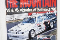 BATHURST 1990: A large laminated Bathurst 1990 Poster 'The Lion Tames The Mountain - V8 & V6 Victories at Bathurst 90' personally signed and inscribed 'To Mike' by Win Percy, measures 140cm high, 97cm wide. - 3
