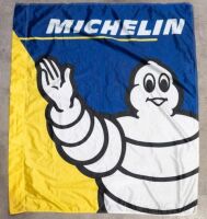 MICHELIN: A modern fabric Michelin dealers flag, featuring waving Bibendum, 136cm high, 114cm wide