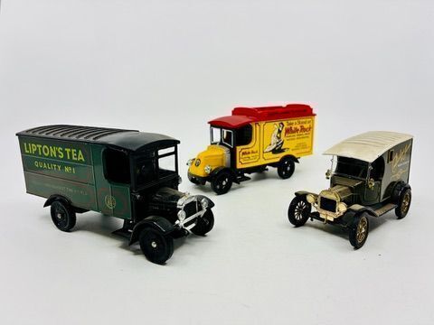 148 · CORGI: Three 1:43 scale Corgi models including two Thornycroft Vans in different liveries and a 1915 Ford Model T Van [Location: Sydney]