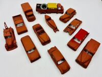 DINKY: Twelve unpainted car and truck bodies, believed to be Dinky. [Location: Sydney]