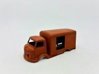 DINKY: Twelve unpainted car and truck bodies, believed to be Dinky. [Location: Sydney] - 2