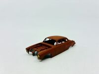 DINKY: Twelve unpainted car and truck bodies, believed to be Dinky. [Location: Sydney] - 8