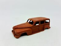 DINKY: Twelve unpainted car and truck bodies, believed to be Dinky. [Location: Sydney] - 12