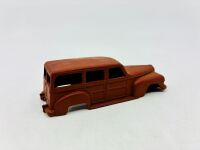 DINKY: Twelve unpainted car and truck bodies, believed to be Dinky. [Location: Sydney] - 13