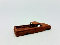 DINKY: Twelve unpainted car and truck bodies, believed to be Dinky. [Location: Sydney] - 15