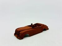 DINKY: Twelve unpainted car and truck bodies, believed to be Dinky. [Location: Sydney] - 18
