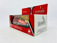 HOLDEN: A 1:43 scale model by Classic Carlectables of the #888 Team Vodafone Holden VE Commodore driven by Craig Lowndes in the 2010 V8 Supercars season, limited edition 0119/1600, complete with certificate of authenticity [Location: Sydney] - 10