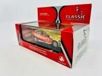 HOLDEN: A 1:43 scale model by Classic Carlectables of the #1 Team Vodafone Holden VE Commodore driven by Jamie Whincup in the 2010 V8 Supercars season, limited edition 0119/1600, complete with certificate of authenticity [Location: Sydney] - 10