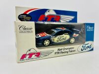 FORD: Two 1:43 scale limited edition models by Classic Carlectables of the FTR Ford AU Falcons driven by Neil Crompton and Glenn Seton [Location: Sydney] - 2