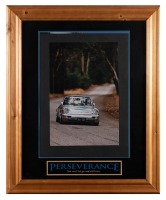ROSELYN POON: A framed and glazed photograph of a Porsche 911 in silver #17, as driven by Australian Porsche Cup driver, Roselyn Poon; the only Porsche Cup female driver in the series-late 1990s Australia. Measures 84cm high, 68cm wide