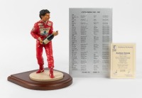 AYRTON SENNA: A 1:9 scale limited edition (2205/7500) cold cast porcelain resin figure of Ayrton Senna sculpted by Tim Potts for Endurance Ltd, on wooden base, NIB and accompanied by a COA from The Art of Sport, 22cm high