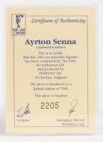 AYRTON SENNA: A 1:9 scale limited edition (2205/7500) cold cast porcelain resin figure of Ayrton Senna sculpted by Tim Potts for Endurance Ltd, on wooden base, NIB and accompanied by a COA from The Art of Sport, 22cm high - 2