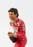 AYRTON SENNA: A 1:9 scale limited edition (2205/7500) cold cast porcelain resin figure of Ayrton Senna sculpted by Tim Potts for Endurance Ltd, on wooden base, NIB and accompanied by a COA from The Art of Sport, 22cm high - 3