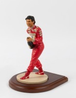 AYRTON SENNA: A 1:9 scale limited edition (2205/7500) cold cast porcelain resin figure of Ayrton Senna sculpted by Tim Potts for Endurance Ltd, on wooden base, NIB and accompanied by a COA from The Art of Sport, 22cm high - 4