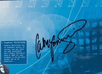 GARRY ROGERS: A framed and glazed poster 'Garry Rogers Motorsport 2004', signed by Cameron McConville and Garth Tander, measures 43.5cm high, 62cm wide. - 2