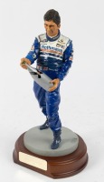 HILL: A 1:9 scale limited edition (0606/2500) cold cast porcelain resin figure of Damon Hill sculpted by Paul Szeiler for Endurance Ltd, on wooden base, NIB and accompanied by a COA from The Art of Sport, 22cm high - 2
