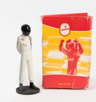 MCQUEEN: A 1:18 scale figurine of Steve Mcqueen by VF Drivers, made in Italy
