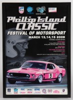 PHILLIP ISLAND: A framed and perpex glazed poster for the 2009 Phillip Island Classic Festival of Motorsport, measures 62.5cm high, 45cm wide. Faded.